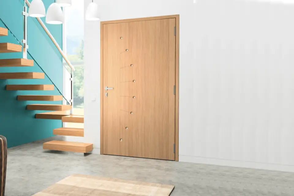 Porte d’entrée en bois claire dans un intérieur contemporain